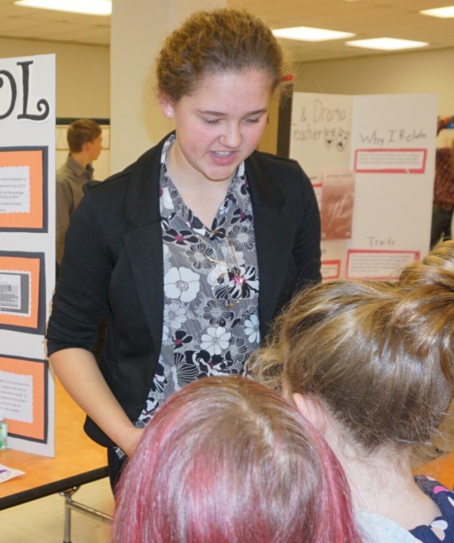 girl talking to young people